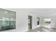 Bright sunroom with large windows and wood-look flooring at 1800 4Th Nw St, Winter Haven, FL 33881