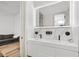 Modern bathroom with double vanity and LED mirror at 193 Stargrass Dr, Auburndale, FL 33823