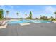 Relaxing kidney-shaped community pool with lake view at 193 Stargrass Dr, Auburndale, FL 33823