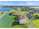 Aerial view of house near lake at 193 Stargrass Dr, Auburndale, FL 33823