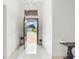 Bright entryway with open door view, showcasing a modern home exterior and paved driveway at 193 Stargrass Dr, Auburndale, FL 33823
