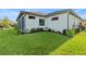 White house exterior with a screened porch and lush landscaping at 193 Stargrass Dr, Auburndale, FL 33823