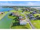 Aerial view of house near lake at 193 Stargrass Dr, Auburndale, FL 33823