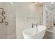 Spa-like bathroom with soaking tub, walk-in shower, and modern fixtures at 193 Stargrass Dr, Auburndale, FL 33823