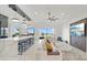 Open concept kitchen with modern island and living room view at 193 Stargrass Dr, Auburndale, FL 33823