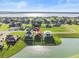 Aerial view of house near lake at 193 Stargrass Dr, Auburndale, FL 33823