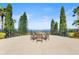 Community fire pit with seating area and lake view at 193 Stargrass Dr, Auburndale, FL 33823