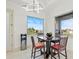 Bright breakfast nook with a table and chairs, offering a view of the backyard at 193 Stargrass Dr, Auburndale, FL 33823