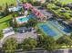 Aerial view showing community amenities including pools and tennis courts at 193 Stargrass Dr, Auburndale, FL 33823