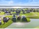 Aerial view of house near lake at 193 Stargrass Dr, Auburndale, FL 33823