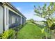 Screened patio with a lake view and lush landscaping at 193 Stargrass Dr, Auburndale, FL 33823