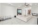 Spacious living room boasts a large sectional sofa and modern media wall at 193 Stargrass Dr, Auburndale, FL 33823