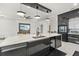 Modern kitchen with a large island, wine cooler, and high-end appliances at 193 Stargrass Dr, Auburndale, FL 33823