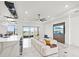 Spacious living room with a large sectional sofa, modern TV feature wall, and water views at 193 Stargrass Dr, Auburndale, FL 33823