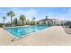 Community pool with lounge chairs and clubhouse in background at 193 Stargrass Dr, Auburndale, FL 33823