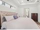 Bright and airy main bedroom with an ensuite bathroom access at 193 Stargrass Dr, Auburndale, FL 33823