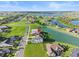 Aerial view of house near lake at 193 Stargrass Dr, Auburndale, FL 33823