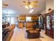 Open kitchen with wood cabinets, stainless steel appliances, and ample counter space at 1937 Rifle Range Rd, Winter Haven, FL 33880