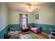 Cozy bedroom with two twin beds, window, and ceiling fan at 1937 Rifle Range Rd, Winter Haven, FL 33880
