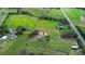 Aerial view of property showing house, expansive land, and surrounding farmlands at 1937 Rifle Range Rd, Winter Haven, FL 33880