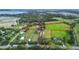 Aerial view of expansive property with multiple buildings and large land area at 1957 Rifle Range Rd, Winter Haven, FL 33880