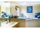 Updated bathroom with walk-in tub, double sinks, and decorative accents at 1957 Rifle Range Rd, Winter Haven, FL 33880