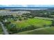 Aerial view of property near lake and community at 1957 Rifle Range Rd, Winter Haven, FL 33880