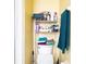 Small bathroom with toilet and storage shelving at 1957 Rifle Range Rd, Winter Haven, FL 33880