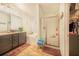 Elegant bathroom with double vanity, soaking tub, and a separate shower at 230 Grouper Ct, Poinciana, FL 34759