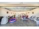 Spacious garage converted into a recreational area with seating and storage at 230 Grouper Ct, Poinciana, FL 34759