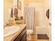 Clean bathroom with tub shower combo, and dark vanity at 230 Grouper Ct, Poinciana, FL 34759