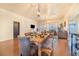 Open dining room with a rustic wooden table and chairs at 230 Grouper Ct, Poinciana, FL 34759