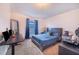 Guest bedroom with a queen bed, a workspace, and ample natural light at 230 Grouper Ct, Poinciana, FL 34759
