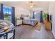 Spacious main bedroom with a king-size bed and plenty of natural light at 230 Grouper Ct, Poinciana, FL 34759