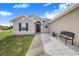 Well-maintained house with a walkway and a bench at 230 Grouper Ct, Poinciana, FL 34759