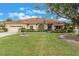 One-story house with a two-car garage and a well-maintained lawn at 3002 Plantation Rd, Winter Haven, FL 33884