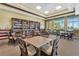 Community library with bookshelves, tables, and chairs at 3659 Plymouth Dr, Winter Haven, FL 33884