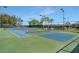 Tennis and pickleball courts with surrounding fencing at 3659 Plymouth Dr, Winter Haven, FL 33884