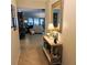 Bright and spacious foyer with decorative elements and view into living room at 4163 Pirates Lndg, Winter Haven, FL 33884