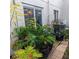Lush backyard with tropical plants and a brick patio at 4163 Pirates Lndg, Winter Haven, FL 33884