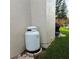 White propane tank sits against the house exterior at 4163 Pirates Lndg, Winter Haven, FL 33884