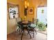 Cozy kitchen breakfast nook with a small round table and chairs at 4163 Pirates Lndg, Winter Haven, FL 33884