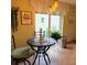 Bright kitchen nook features a round table and chairs, perfect for casual dining at 4163 Pirates Lndg, Winter Haven, FL 33884