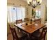 Cozy dining area with a wooden table and chairs, near kitchen access at 4163 Pirates Lndg, Winter Haven, FL 33884