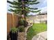 Landscaped backyard with a bird bath, plants, and a small sitting area at 4163 Pirates Lndg, Winter Haven, FL 33884