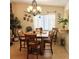 Charming dining area with a wooden table and four chairs at 4163 Pirates Lndg, Winter Haven, FL 33884