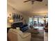 Spacious living room featuring comfortable seating, a large TV, and a cozy fireplace at 4163 Pirates Lndg, Winter Haven, FL 33884
