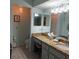 Updated bathroom with granite vanity and large mirror at 4163 Pirates Lndg, Winter Haven, FL 33884