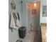 Clean bathroom with tile floors and stylish storage at 4163 Pirates Lndg, Winter Haven, FL 33884