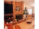 Elegant brick fireplace as a focal point in the living room at 4163 Pirates Lndg, Winter Haven, FL 33884